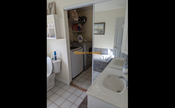 Attached Bathroom with laundry